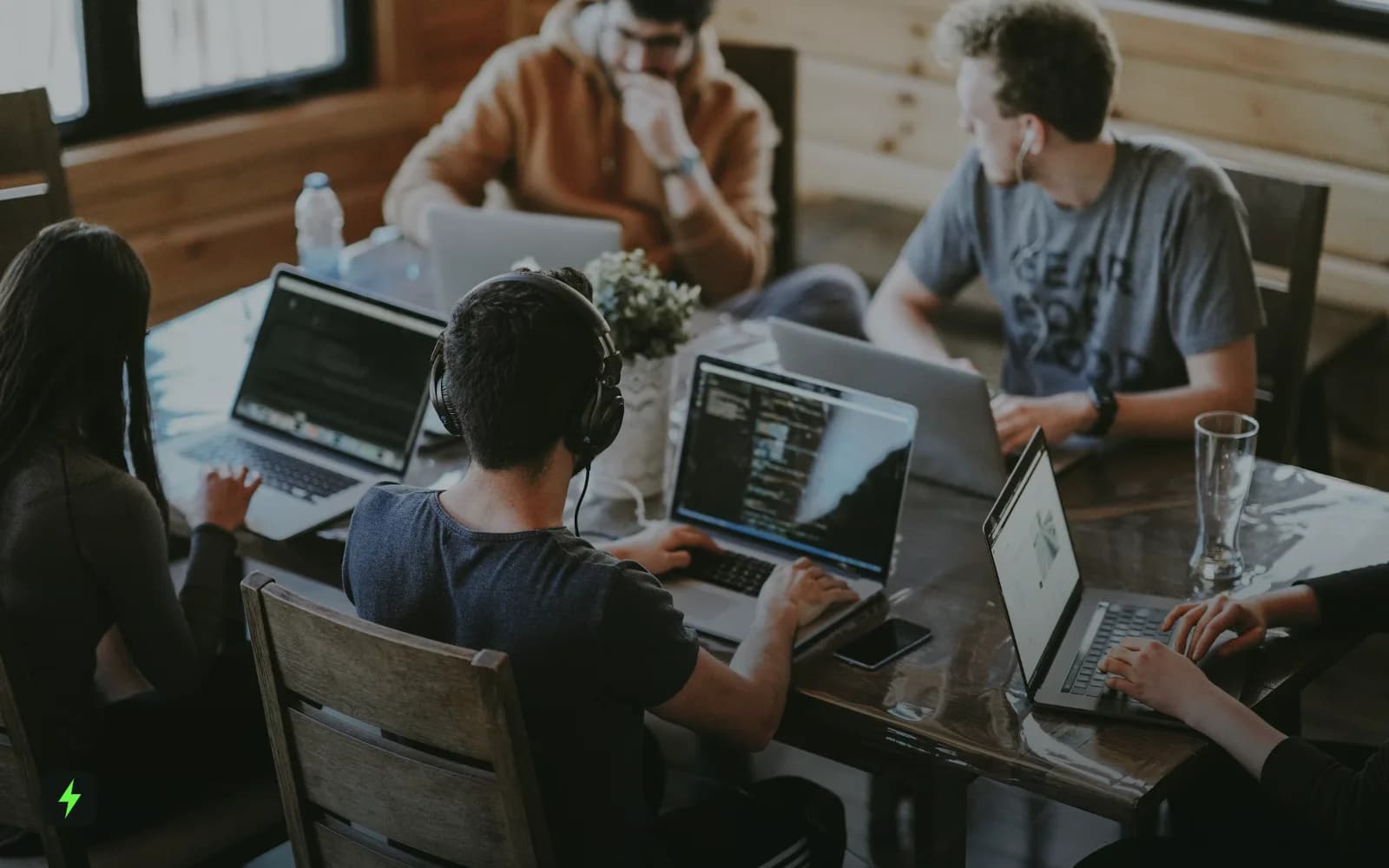 A team working together on laptops around a table
