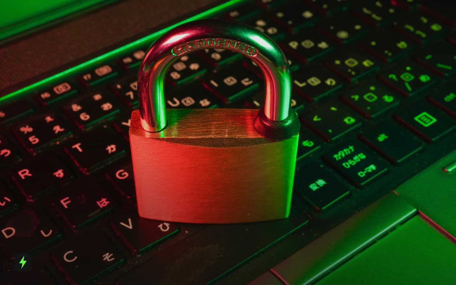 A red padlock resting on a laptop keyboard